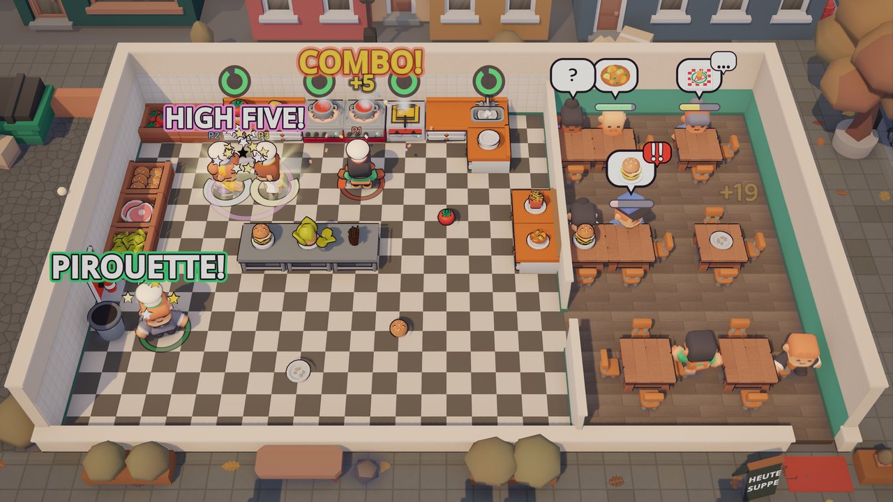 Wide view of the whole restaurant during service: kitchen, dining room with guests at tables, orders stacking up.